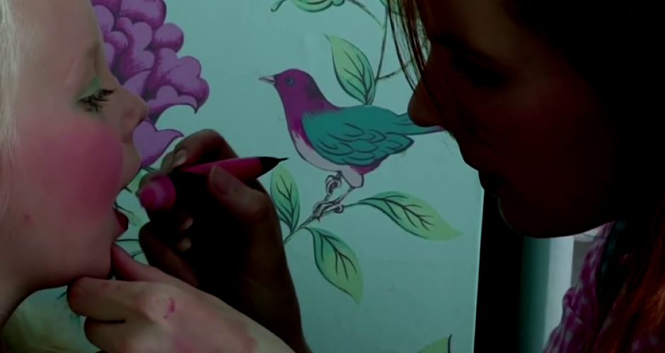 woman paints an app. 6 years old girl