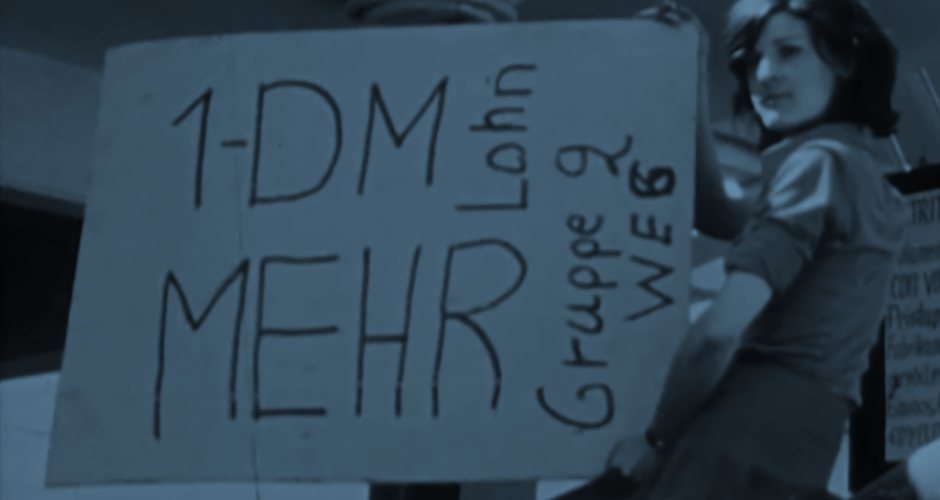 Pierburg - Ihr Kampf ist unser Kampf Frau hält ein Schild mit der Aufschrift 1 DM mehr