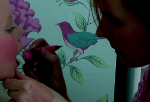 woman paints an app. 6 years old girl